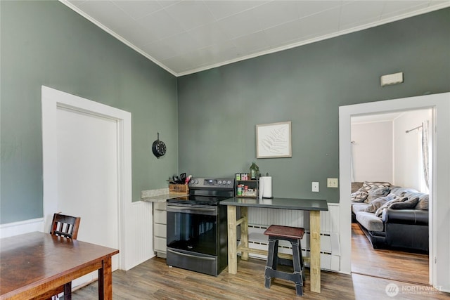 home office featuring ornamental molding and wood finished floors