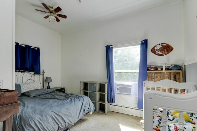 carpeted bedroom featuring cooling unit, ceiling fan, and baseboard heating