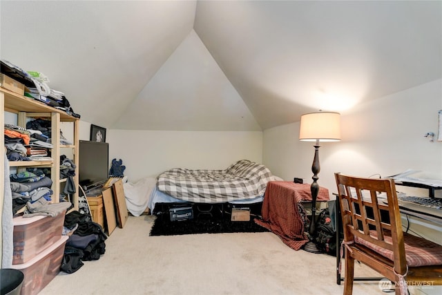 bedroom with carpet floors and vaulted ceiling