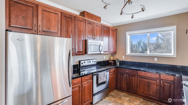 kitchen with stainless steel appliances and crown molding