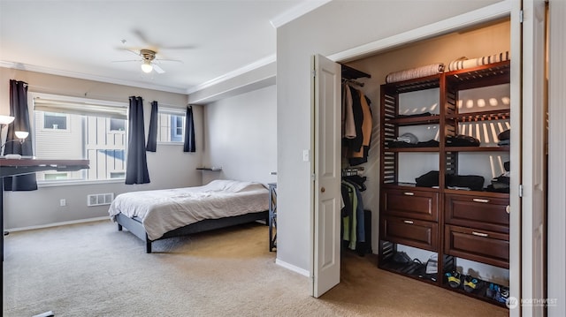 bedroom featuring crown molding, ceiling fan, and carpet