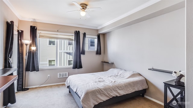 bedroom featuring crown molding, light colored carpet, and ceiling fan