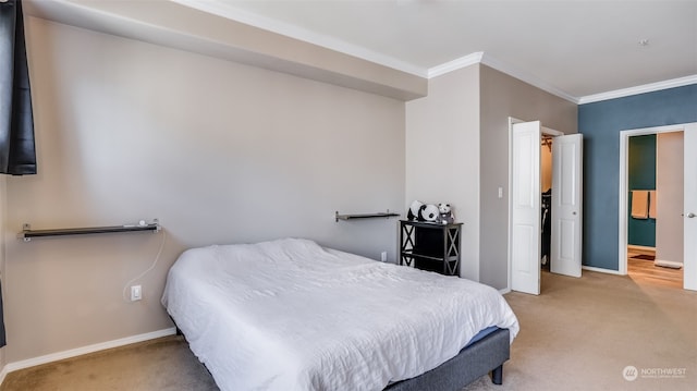 bedroom featuring ornamental molding and carpet