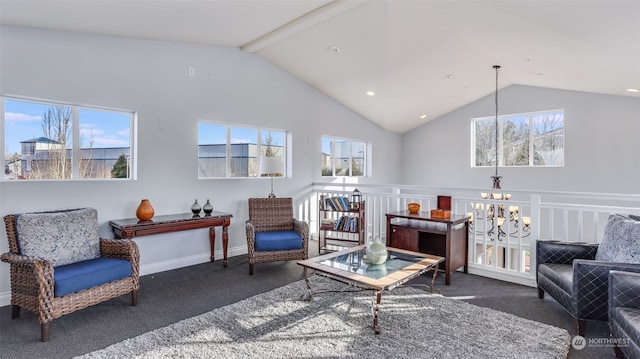 carpeted living room with beamed ceiling, high vaulted ceiling, plenty of natural light, and an inviting chandelier