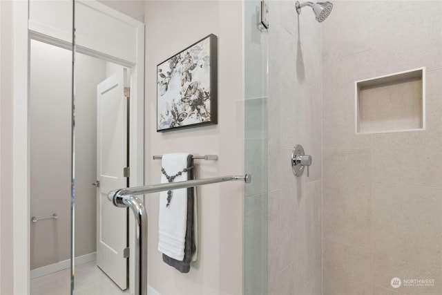 bathroom with walk in shower and tile patterned flooring