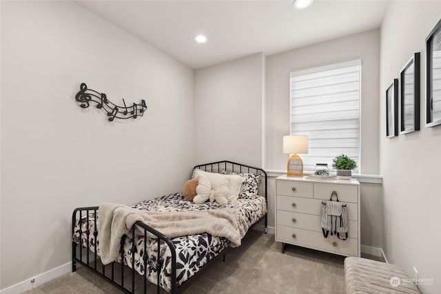 bedroom with multiple windows and carpet