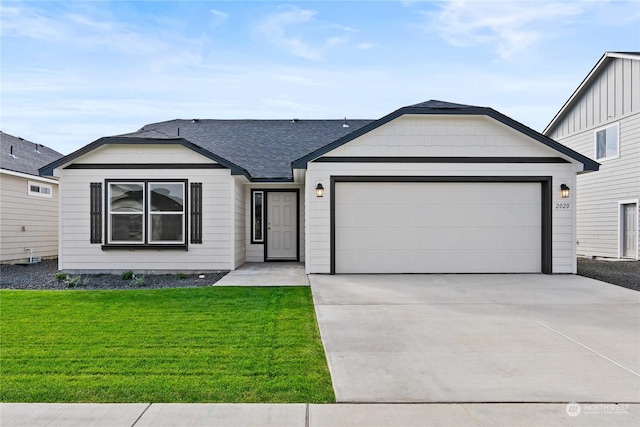 single story home with a garage and a front lawn