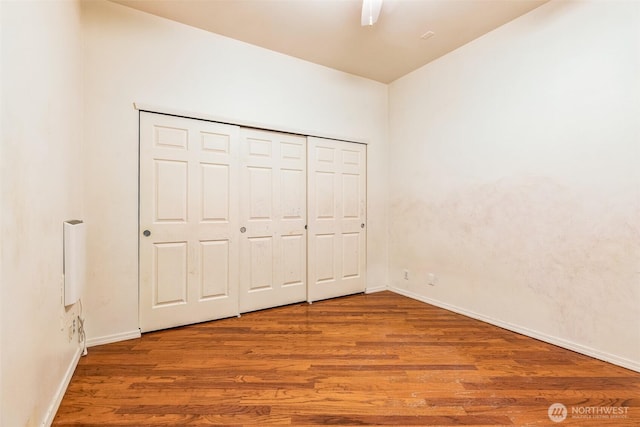 unfurnished bedroom with hardwood / wood-style floors