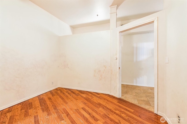 unfurnished room with light hardwood / wood-style floors