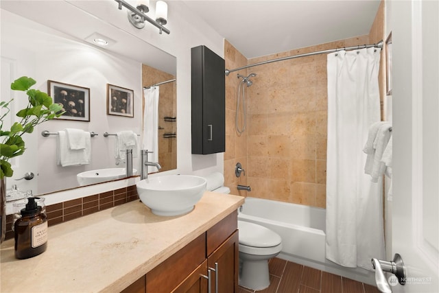 full bathroom with vanity, toilet, hardwood / wood-style floors, and shower / bath combo