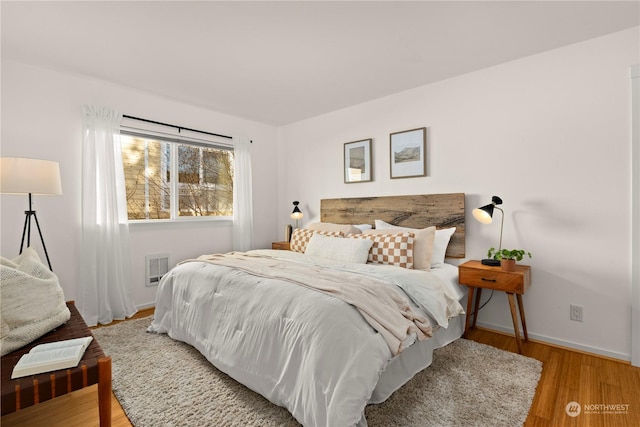 bedroom with light wood-type flooring