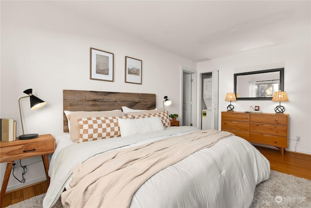 bedroom with hardwood / wood-style flooring