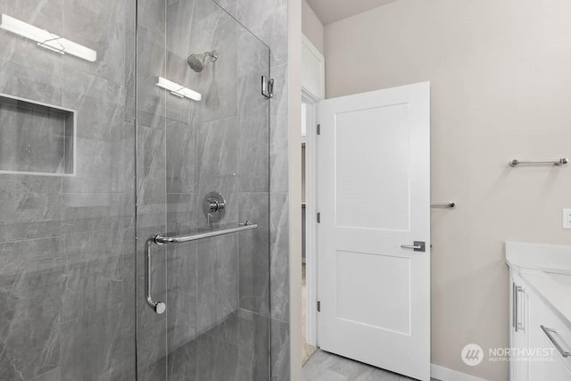 bathroom with vanity and an enclosed shower