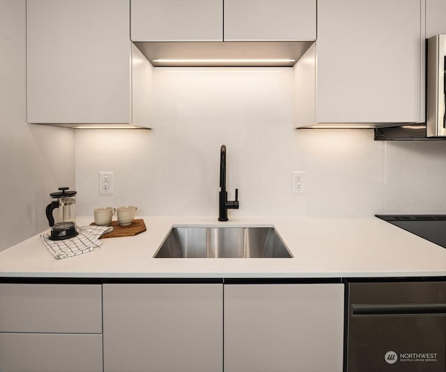 kitchen with sink and white cabinets