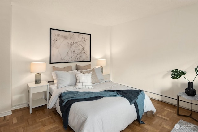 bedroom featuring light parquet floors