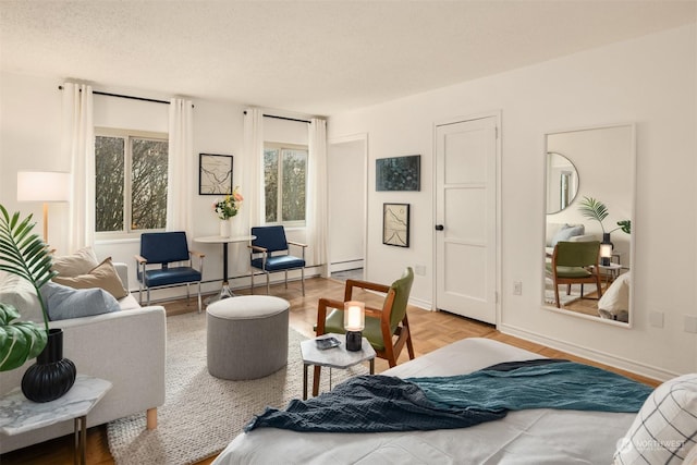 interior space featuring parquet floors and a textured ceiling