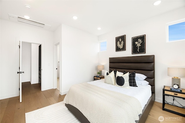bedroom with light wood-style floors, recessed lighting, and baseboards