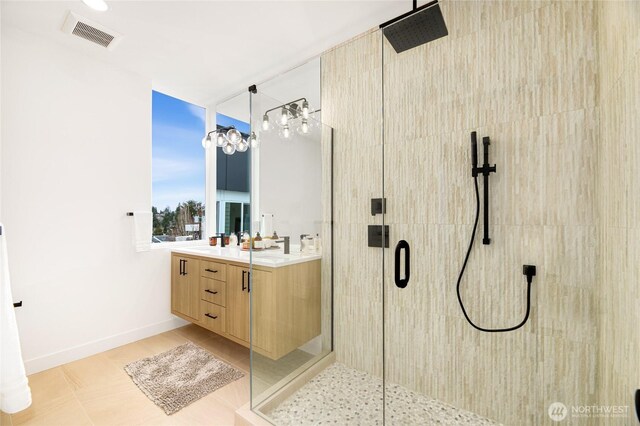 bathroom featuring a stall shower and vanity