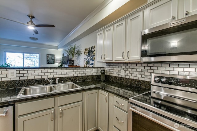 kitchen featuring ornamental molding, appliances with stainless steel finishes, sink, and backsplash