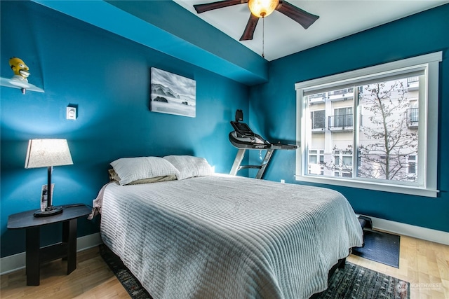 bedroom featuring hardwood / wood-style flooring and ceiling fan