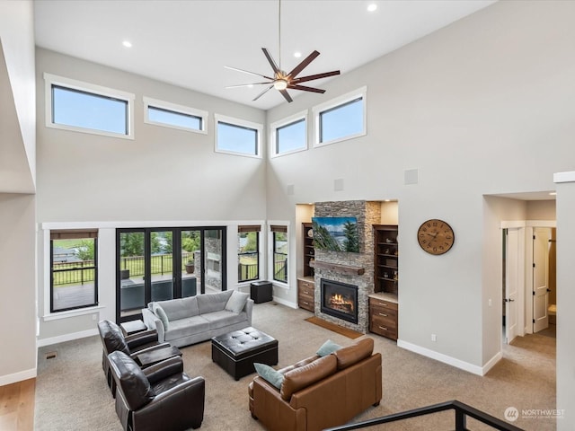 living room with visible vents, baseboards, recessed lighting, a fireplace, and a ceiling fan