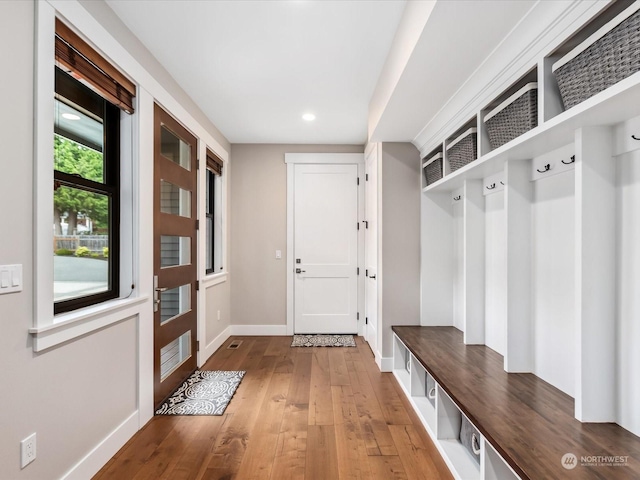 mudroom featuring hardwood / wood-style floors, recessed lighting, and baseboards