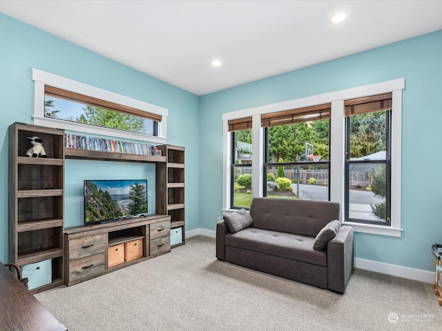 living room with recessed lighting, baseboards, and carpet floors