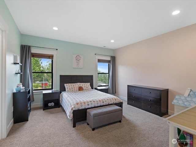bedroom with recessed lighting, light colored carpet, and baseboards
