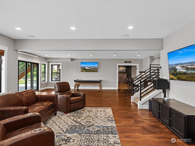 living room featuring stairs, dark wood-type flooring, recessed lighting, and baseboards