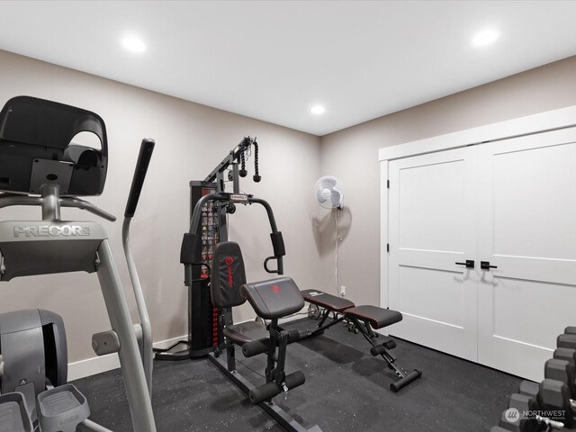 exercise area with recessed lighting and baseboards