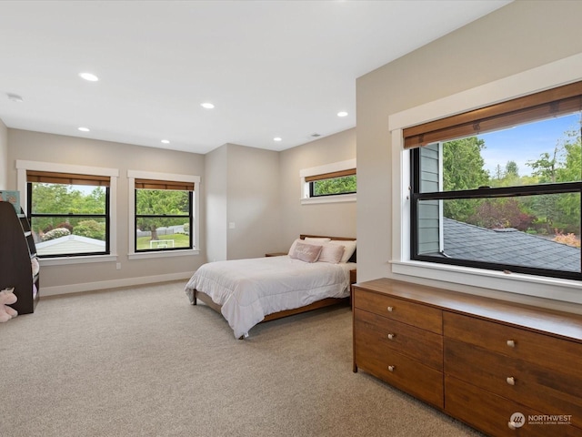 bedroom featuring recessed lighting, baseboards, and light carpet