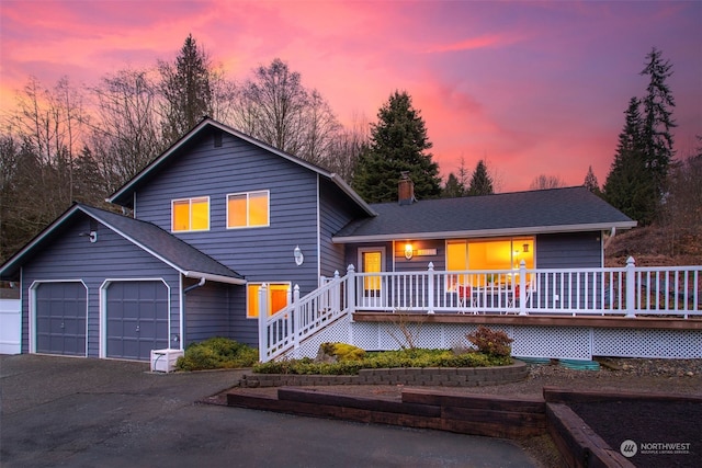 view of front of property featuring a garage and a porch