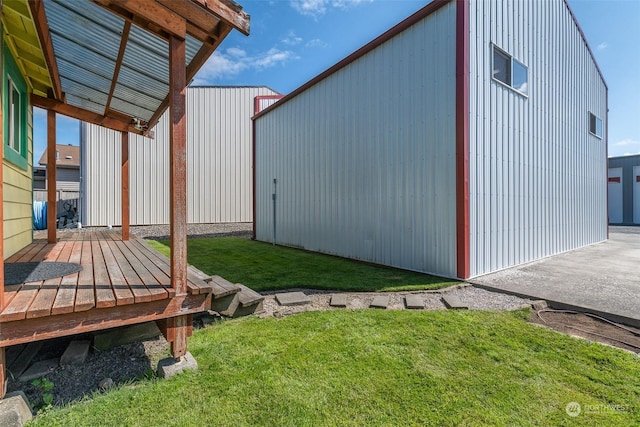 exterior space featuring a lawn and a deck