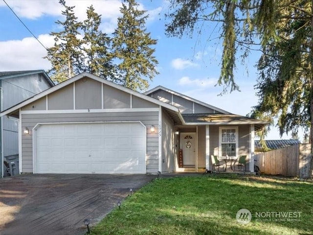 view of front facade featuring a garage and a front lawn