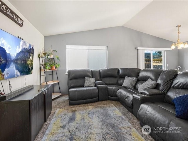 carpeted living room with lofted ceiling and a chandelier