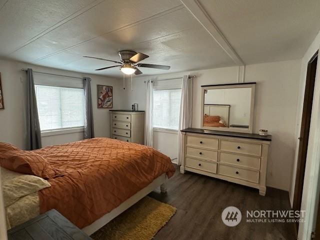 bedroom featuring dark wood-type flooring and ceiling fan