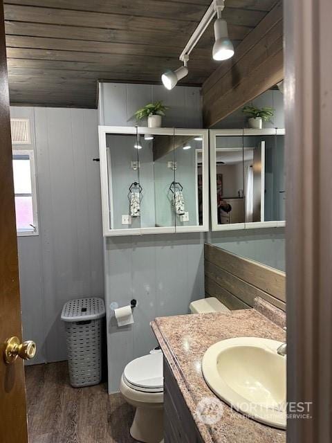 bathroom with wood ceiling, vanity, toilet, and hardwood / wood-style floors