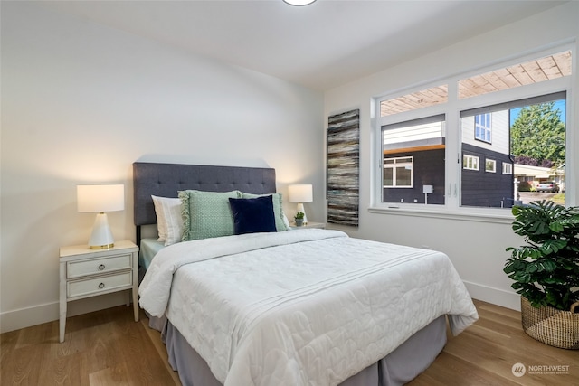 bedroom with light wood-type flooring