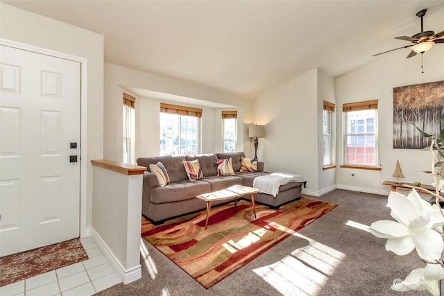 living room featuring light tile patterned floors and vaulted ceiling