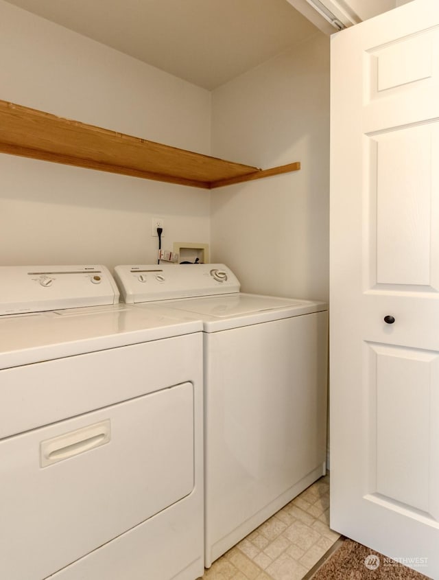 laundry room with independent washer and dryer