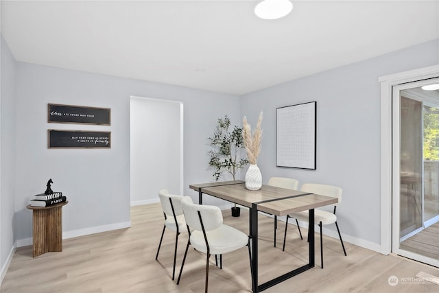 dining area with light wood-type flooring