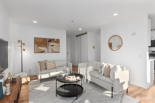 living room with light hardwood / wood-style flooring