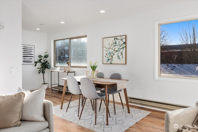 dining space with light wood-type flooring