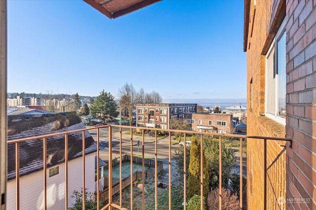 balcony featuring a water view