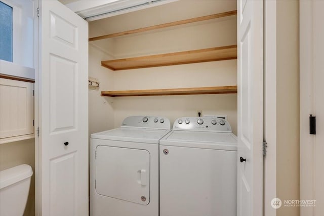 laundry room featuring washing machine and dryer