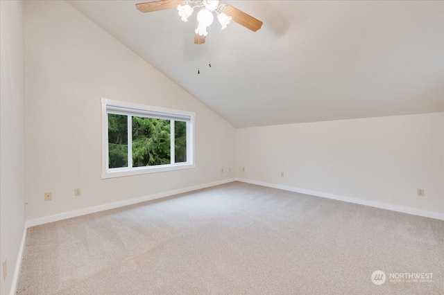 bonus room featuring ceiling fan, lofted ceiling, and light carpet