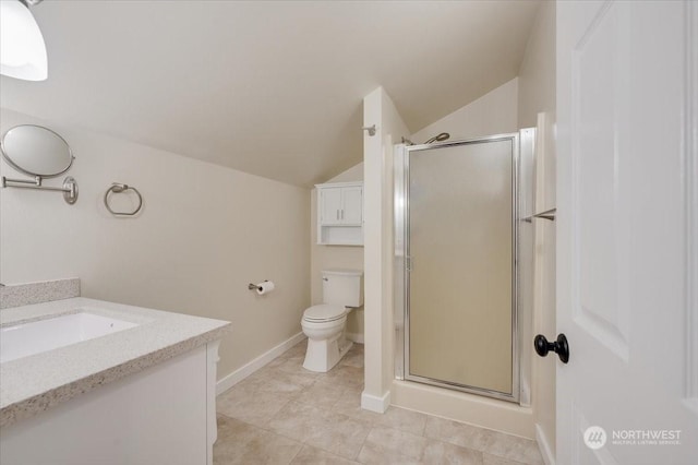 bathroom with lofted ceiling, vanity, toilet, and an enclosed shower