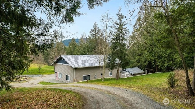 view of side of home featuring a lawn