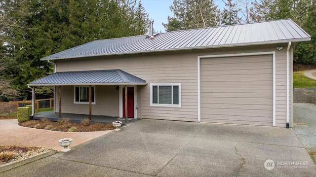 view of front of home with a garage and covered porch