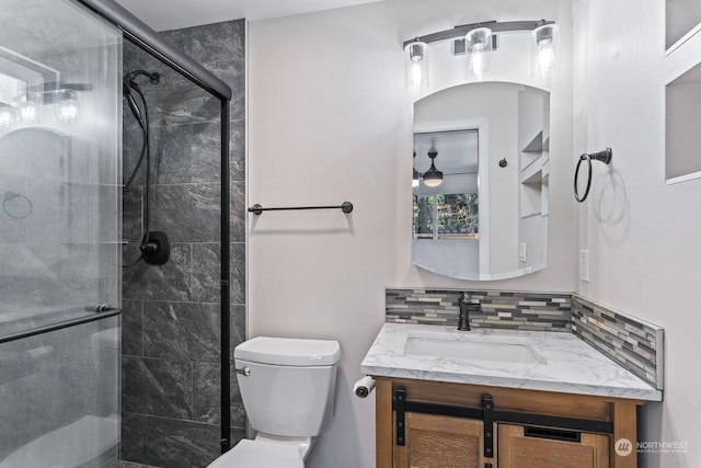 bathroom with vanity, walk in shower, and toilet